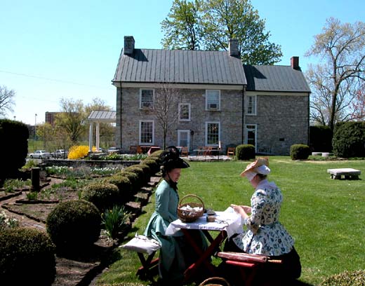 Mrs. Brown & maid in garden housew36